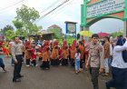 Hadir di Tengah Keceriaan Anak Bangsa, Personil Binmas Polsek Besuki Sukses Kawal Gebyar Drumband Kids TKN Besuki.